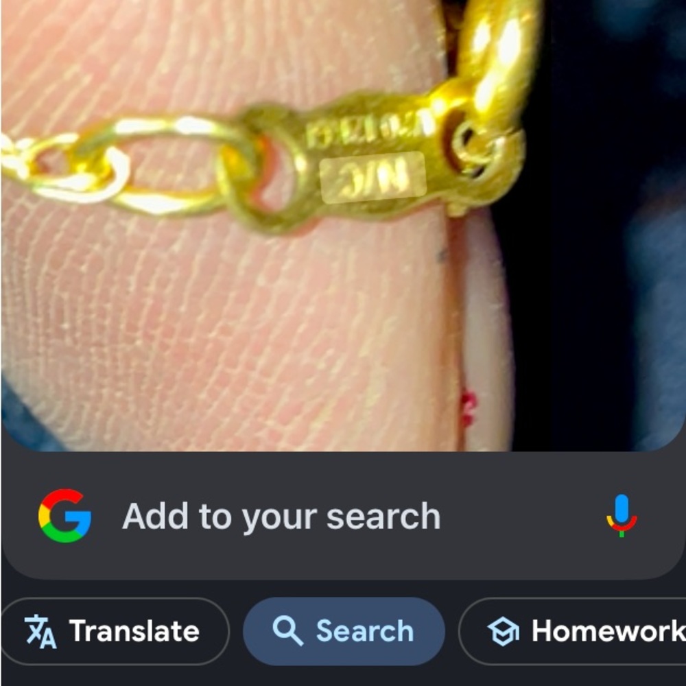 W-w bullet necklace with red rhinestone in center